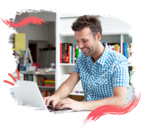 Photo of a man typing on a laptop